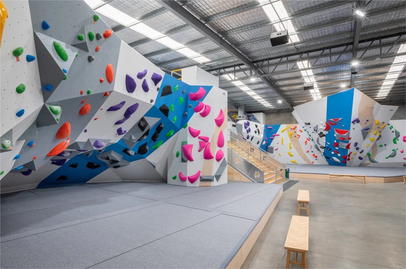 Indoor bouldering gym with colourful climbing walls